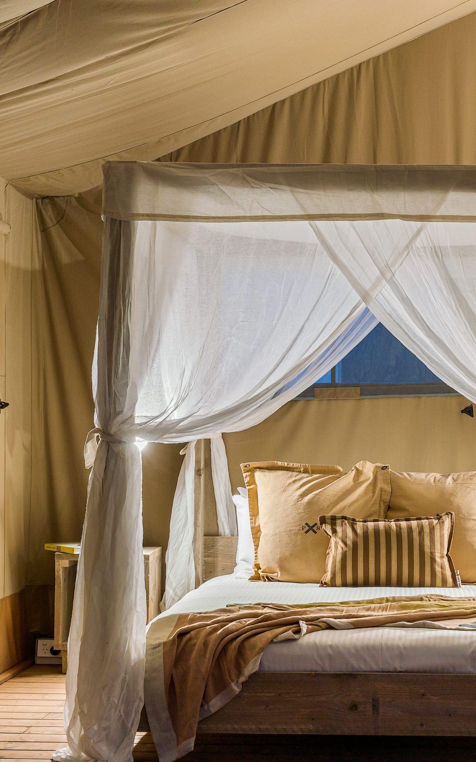 Escape to an Australian coastal wonderland, with canopy bedding & spacious glamping tents.